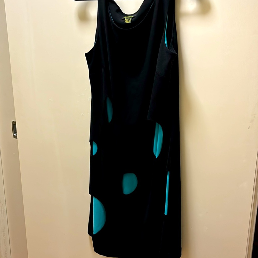 Sleeveless black dress with turquoise cup-outs